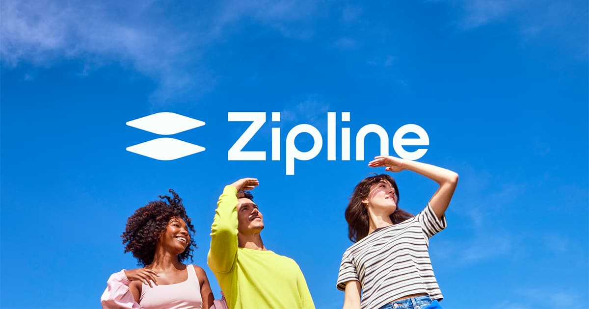 People watching a Zipline delivery aircraft overhead
